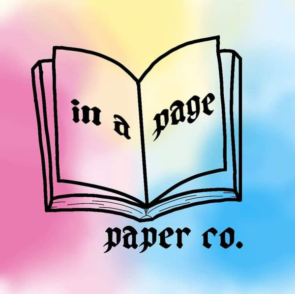An open book with the words in a page inside, and paper co. below