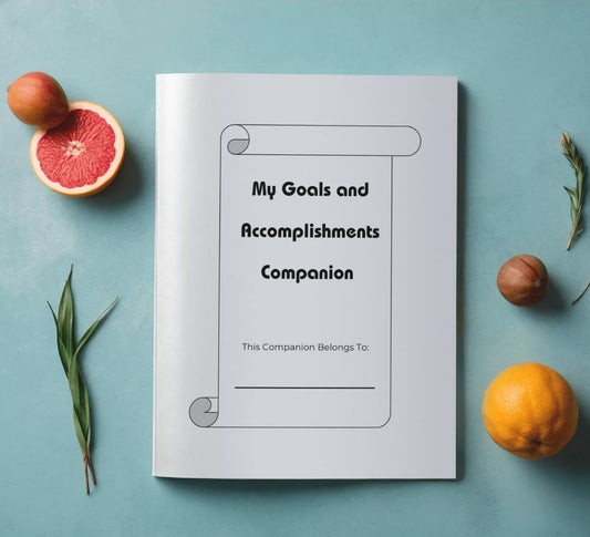 Goals and accomplishments companion journal surrounded by citrus and herbs